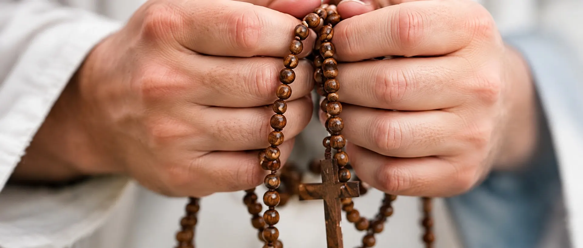 Hands holding a heart in prayer